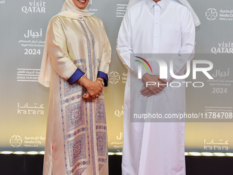 Fatma Al Remaihi, CEO of the Doha Film Institute, and Hamad Bin Abdulaziz Al-Kawari attend the ''Sudan, Remember Us'' red carpet during the...