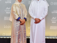 Fatma Al Remaihi, CEO of the Doha Film Institute, and Hamad Bin Abdulaziz Al-Kawari attend the ''Sudan, Remember Us'' red carpet during the...