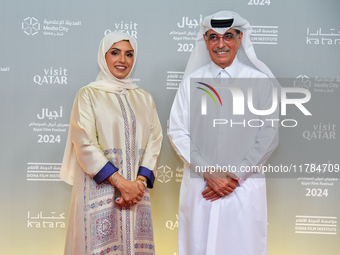 Fatma Al Remaihi, CEO of the Doha Film Institute, and Hamad Bin Abdulaziz Al-Kawari attend the ''Sudan, Remember Us'' red carpet during the...