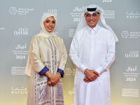 Fatma Al Remaihi, CEO of the Doha Film Institute, and Hamad Bin Abdulaziz Al-Kawari attend the ''Sudan, Remember Us'' red carpet during the...