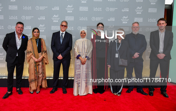 Fatma Al Remaihi, CEO of the Doha Film Institute, and a group of filmmakers attend the ''Sudan, Remember Us'' red carpet during the screenin...