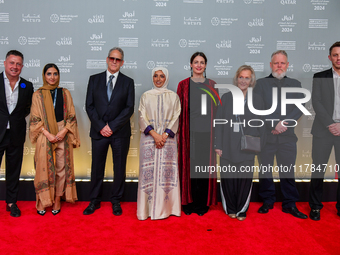 Fatma Al Remaihi, CEO of the Doha Film Institute, and a group of filmmakers attend the ''Sudan, Remember Us'' red carpet during the screenin...