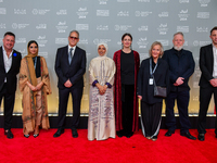 Fatma Al Remaihi, CEO of the Doha Film Institute, and a group of filmmakers attend the ''Sudan, Remember Us'' red carpet during the screenin...