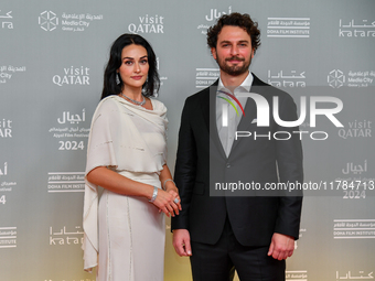 Turkish actress Esra Bilgic (L) attends the 'Sudan, Remember Us' red carpet during the screening on the opening night of the Ajyal Film Fest...