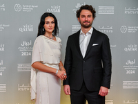 Turkish actress Esra Bilgic (L) attends the 'Sudan, Remember Us' red carpet during the screening on the opening night of the Ajyal Film Fest...