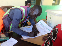 An INEC official writes election results at Ward 2, Unity 6 during the 2024 Governorship election for Ondo State in Ugbonla, Ilaje, Local Go...