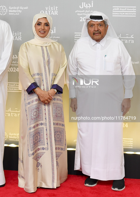 Fatma Al Remaihi, CEO of the Doha Film Institute, and Faisal Bin Qassim Al Thani attend the ''Sudan, Remember Us'' red carpet during the scr...