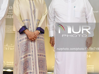 Fatma Al Remaihi, CEO of the Doha Film Institute, and Faisal Bin Qassim Al Thani attend the ''Sudan, Remember Us'' red carpet during the scr...