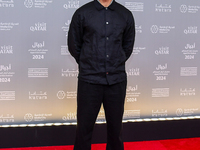 Film-maker Nadir Nahdi attends the 'Sudan, Remember Us' red carpet during the screening on the opening night of the Ajyal Film Festival 2024...