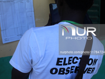 An election observer captures election results at Ward 2, Unity 6 during the 2024 Governorship election for Ondo State in Ugbonla, Ilaje, Lo...