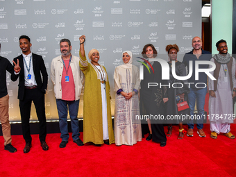 Fatma Al Remaihi, CEO of the Doha Film Institute, Hind Meddeb, Shajane Suliman, and a group of filmmakers from ''Sudan, Remember Us'' attend...