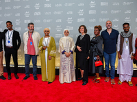 Fatma Al Remaihi, CEO of the Doha Film Institute, Hind Meddeb, Shajane Suliman, and a group of filmmakers from ''Sudan, Remember Us'' attend...