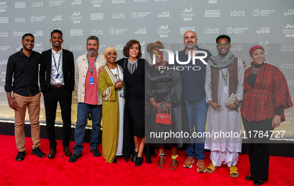 Hind Meddeb (center), Shajane Suliman (fourth from left), and a group of filmmakers from ''Sudan, Remember Us'' attend the ''Sudan, Remember...