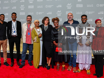 Hind Meddeb (center), Shajane Suliman (fourth from left), and a group of filmmakers from ''Sudan, Remember Us'' attend the ''Sudan, Remember...