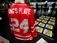 A collectible hockey jersey with the signatures of the 2024 King's Plate jockeys is on view during a raffle to raise funds for LongRun Thoro...