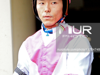 Jockey Daisuke Fukumoto rides out of the paddock ahead of the first race at Woodbine Racetrack in Toronto, Canada, on November 16, 2024. (