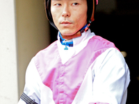 Jockey Daisuke Fukumoto rides out of the paddock ahead of the first race at Woodbine Racetrack in Toronto, Canada, on November 16, 2024. (