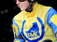 Jockey Cheyenne Kerr rides Speedy River out of the paddock for the second race at Woodbine Racetrack in Toronto, Canada, on November 16, 202...