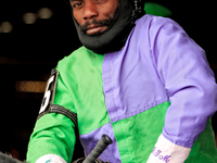 Jockey Juan Crawford rides out of the paddock for the second race at Woodbine Racetrack in Toronto, Canada, on November 16, 2024. (