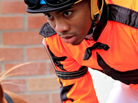 Jockey Desean Bynoe rides out of the paddock for the second race at Woodbine Racetrack in Toronto, Canada, on November 16, 2024. (