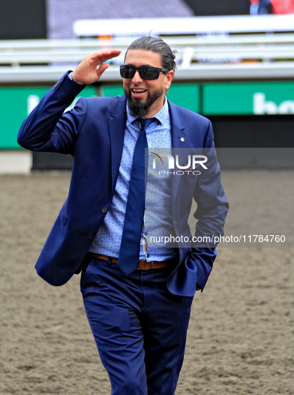 Thoroughbred horse owner Michael Bellissimo gestures after his horse Emerald Lake wins the second race at Woodbine Racetrack in Toronto, Can...