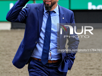 Thoroughbred horse owner Michael Bellissimo gestures after his horse Emerald Lake wins the second race at Woodbine Racetrack in Toronto, Can...