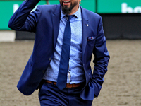 Thoroughbred horse owner Michael Bellissimo gestures after his horse Emerald Lake wins the second race at Woodbine Racetrack in Toronto, Can...