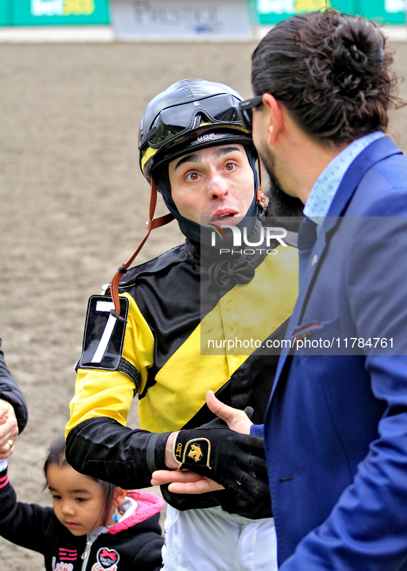 Jockey Leo Salles receives congratulations from thoroughbred owner Michael Bellissimo after Emerald Lake wins the second race at Woodbine Ra...