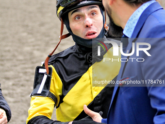 Jockey Leo Salles receives congratulations from thoroughbred owner Michael Bellissimo after Emerald Lake wins the second race at Woodbine Ra...