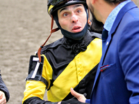 Jockey Leo Salles receives congratulations from thoroughbred owner Michael Bellissimo after Emerald Lake wins the second race at Woodbine Ra...