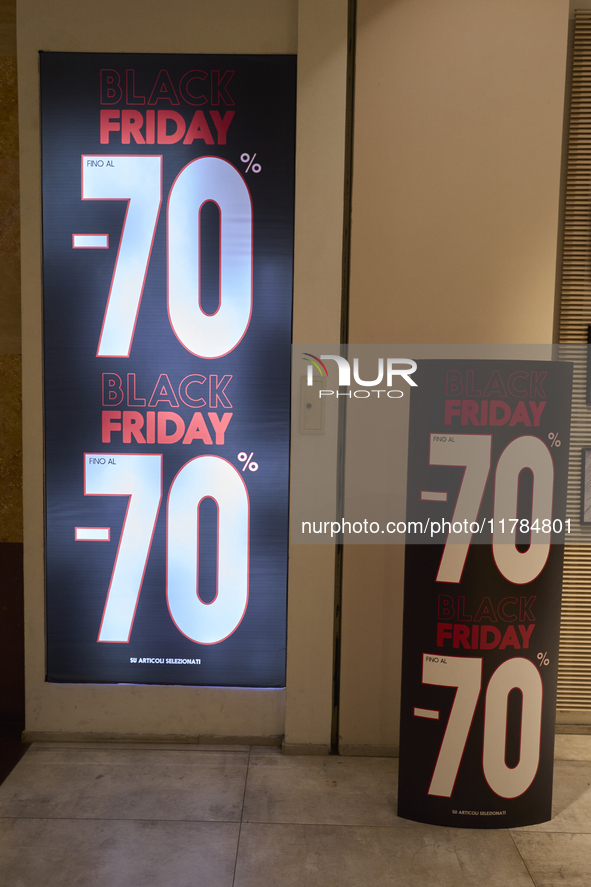 Promotional signage advertises up to 70% off for Black Friday at a clothing store in Molfetta, Italy, on November 17, 2024. The image highli...