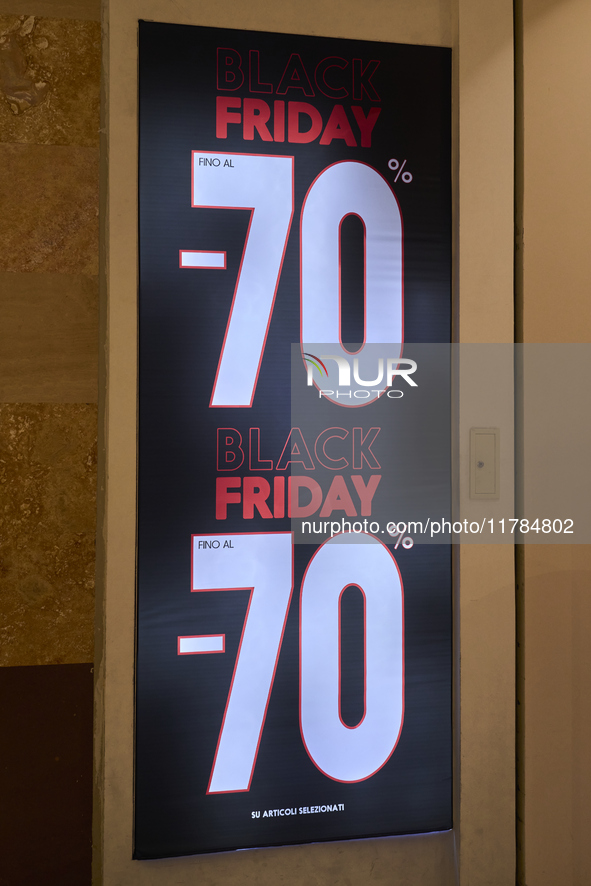 Promotional signage advertises up to 70% off for Black Friday at a clothing store in Molfetta, Italy, on November 17, 2024. The image highli...