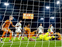 Netherlands defender Denzel Dumfries, Hungary midfielder Tamas Nikitscher, and Netherlands defender Virgil van Dijk participate in the match...