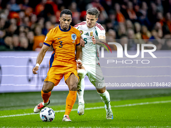 Netherlands defender Jurrien Timber and Hungary midfielder Tamas Nikitscher play during the match between the Netherlands and Hungary at the...