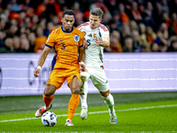 Netherlands defender Jurrien Timber and Hungary midfielder Tamas Nikitscher play during the match between the Netherlands and Hungary at the...