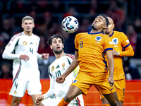 Hungary midfielder Dominik Szoboslai and Netherlands midfielder Ryan Gravenberch play during the match between the Netherlands and Hungary a...