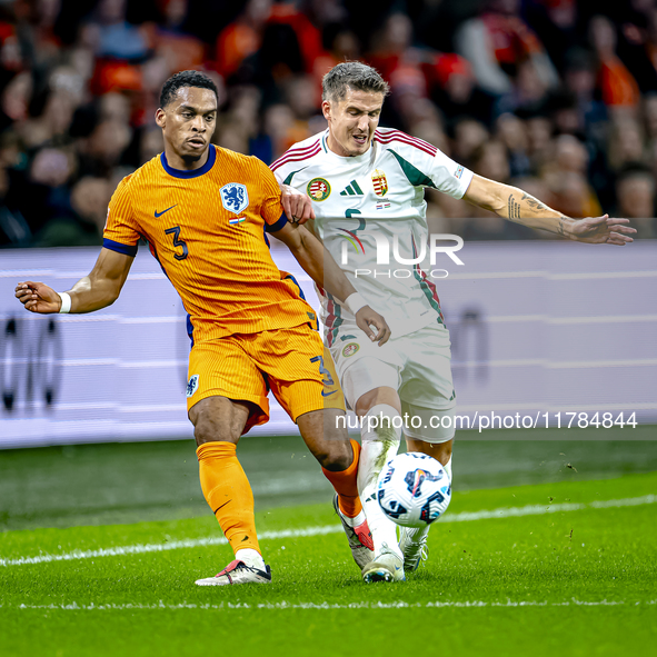 Netherlands defender Jurrien Timber and Hungary midfielder Tamas Nikitscher play during the match between the Netherlands and Hungary at the...