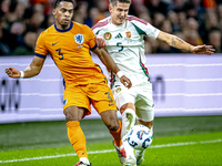 Netherlands defender Jurrien Timber and Hungary midfielder Tamas Nikitscher play during the match between the Netherlands and Hungary at the...