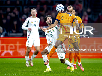 Hungary midfielder Dominik Szoboslai and Netherlands midfielder Ryan Gravenberch play during the match between the Netherlands and Hungary a...