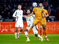 Hungary midfielder Dominik Szoboslai and Netherlands midfielder Ryan Gravenberch play during the match between the Netherlands and Hungary a...