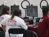 People apply for permanent driver's licenses at a processing point installed in the Ciudad Deportiva, in the Iztacalco mayor's office, in Me...