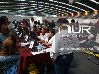 People apply for permanent driver's licenses at a processing point installed in the Ciudad Deportiva, in the Iztacalco mayor's office, in Me...