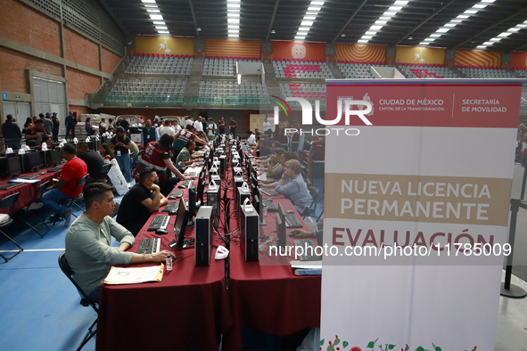 People apply for permanent driver's licenses at a processing point installed in the Ciudad Deportiva, in the Iztacalco mayor's office, in Me...