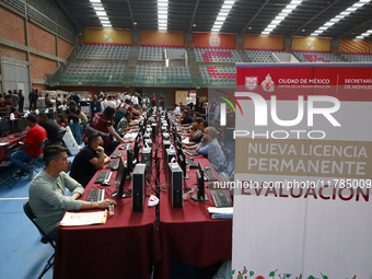 People apply for permanent driver's licenses at a processing point installed in the Ciudad Deportiva, in the Iztacalco mayor's office, in Me...