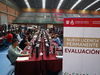 People apply for permanent driver's licenses at a processing point installed in the Ciudad Deportiva, in the Iztacalco mayor's office, in Me...