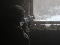 One of the new soldiers of the 57th Otaman Kost Hordiienko Motorized Brigade practices assault skills in the Kharkiv region, Ukraine, on Nov...