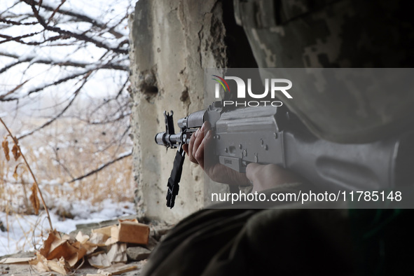 One of the new soldiers of the 57th Otaman Kost Hordiienko Motorized Brigade practices assault skills in the Kharkiv region, Ukraine, on Nov...