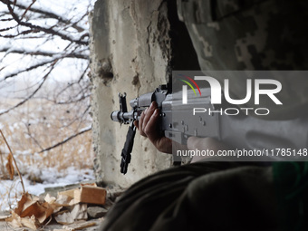 One of the new soldiers of the 57th Otaman Kost Hordiienko Motorized Brigade practices assault skills in the Kharkiv region, Ukraine, on Nov...