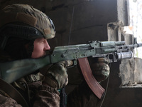 One of the new soldiers of the 57th Otaman Kost Hordiienko Motorized Brigade practices assault skills in the Kharkiv region, Ukraine, on Nov...