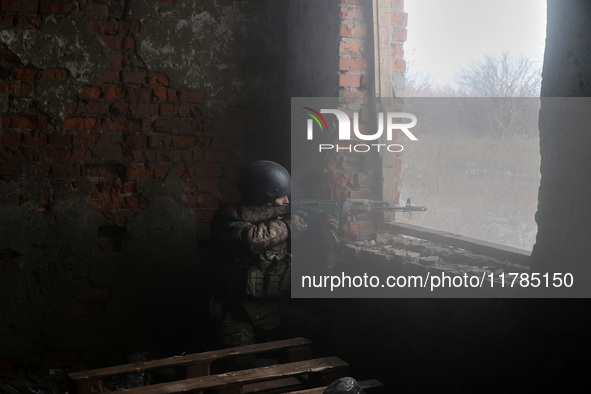 One of the new soldiers of the 57th Otaman Kost Hordiienko Motorized Brigade practices assault skills in the Kharkiv region, Ukraine, on Nov...